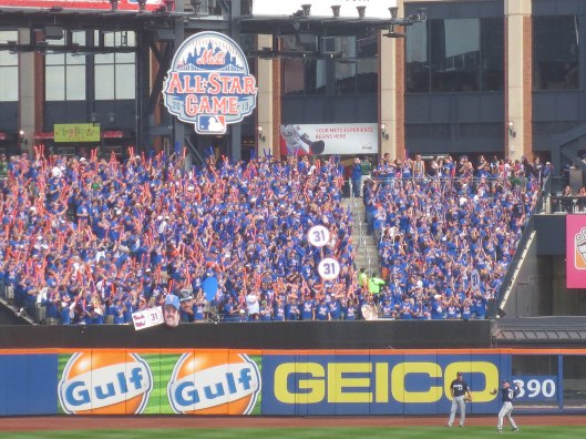 20_brewers_warming_up_in_front_of_packed_section_with_7_line_army_fans